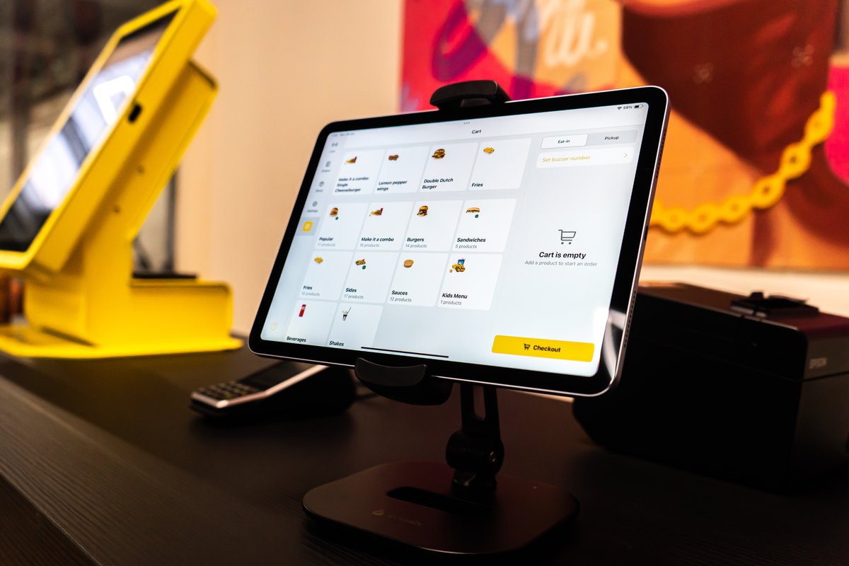 Onesix POS system in a hospitality venue showing sales figures and data on screen