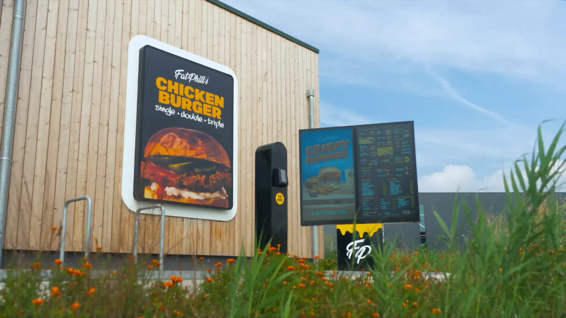 Onesix Drive-Thru at Fat Phill's: intercom with payment terminal and menu screens at the order point
