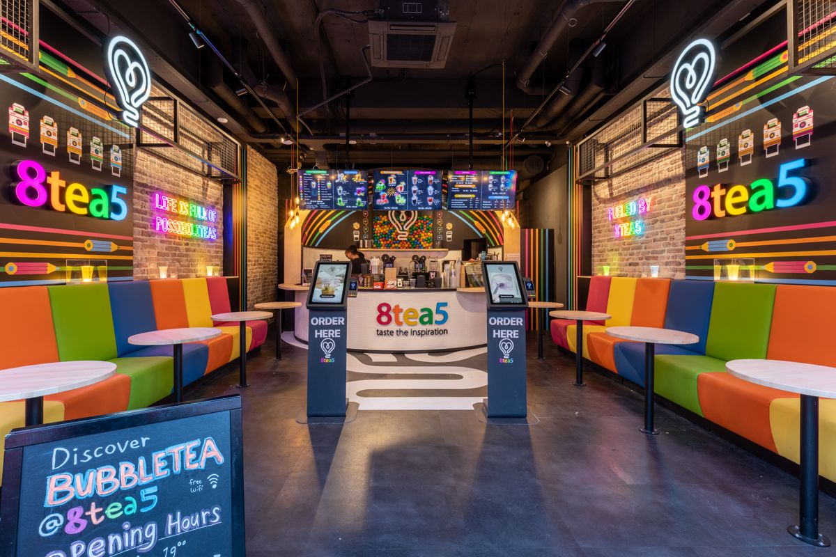 Two Onesix Kiosks marked 'Order here' in front of the counter at bubble tea venue 8Tea5 in Rotterdam