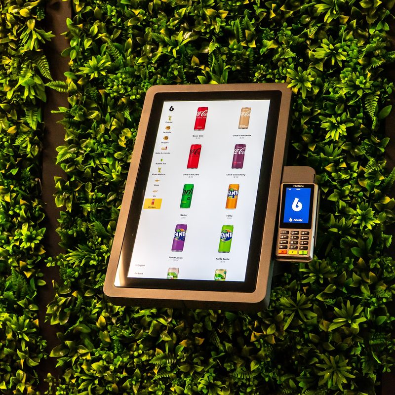 Onesix Kiosk Pro Wall on a green plant wall